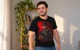 The same man wearing the t-shirt with a printed design