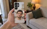 The same phone in a case printed with a portrait