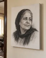 A pencil portrait of an older woman on canvas